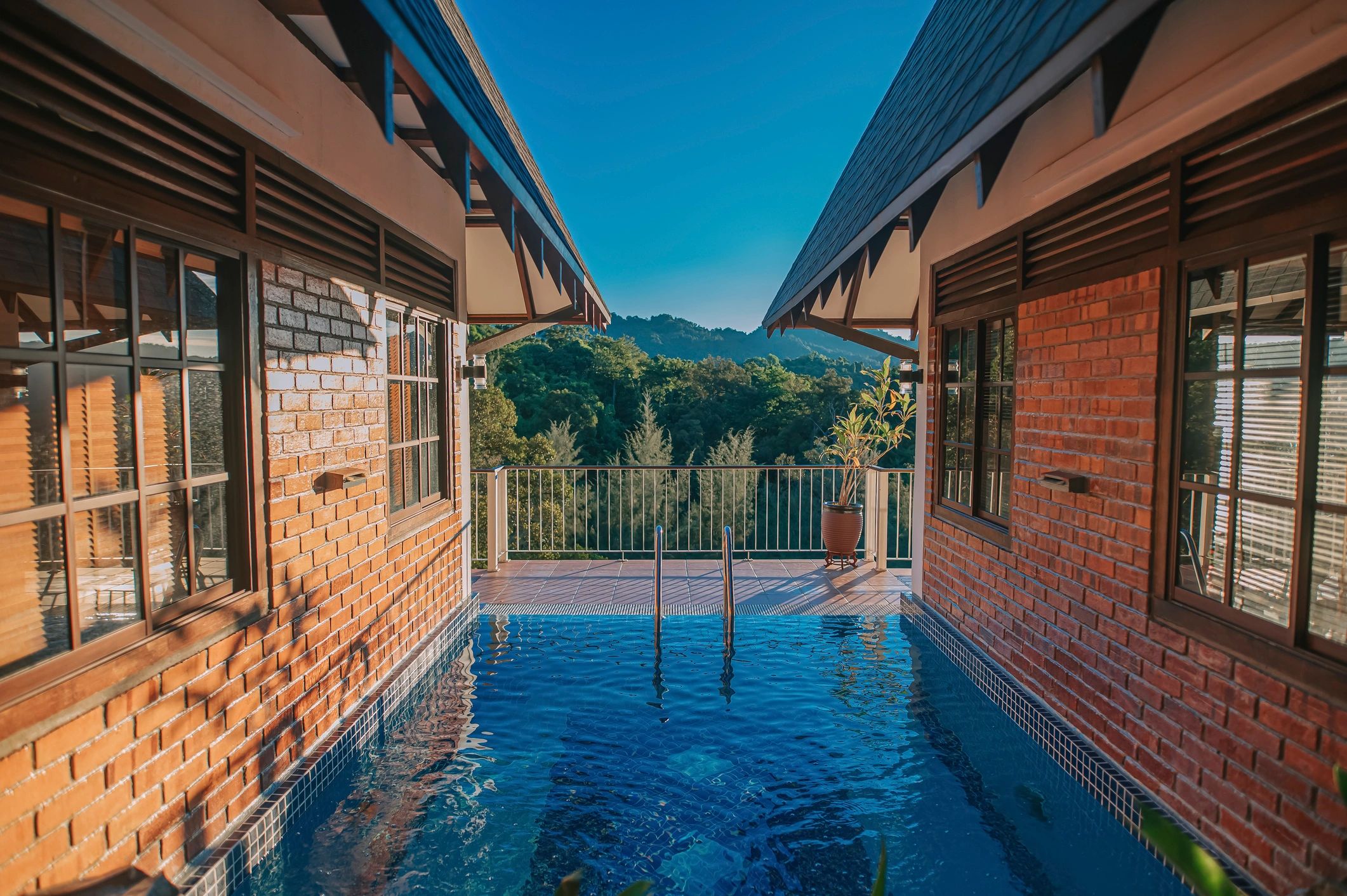 Resort villa pool with mountain and forest view