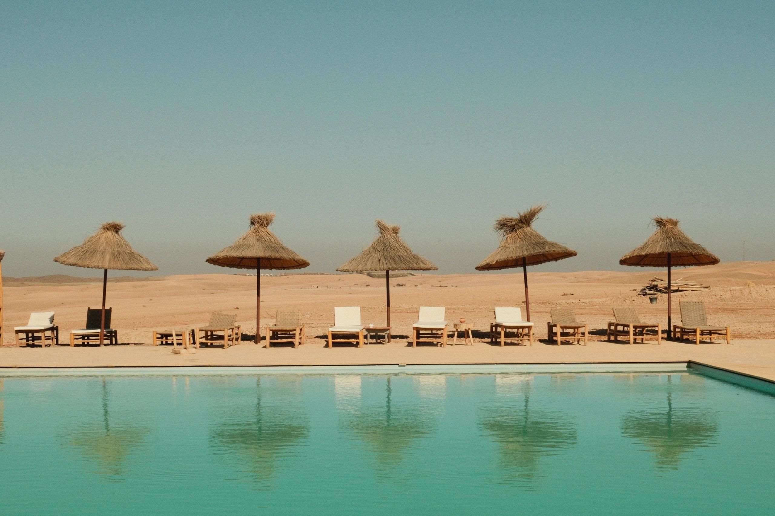 Resort pool scene used as testimonial avatar placeholder